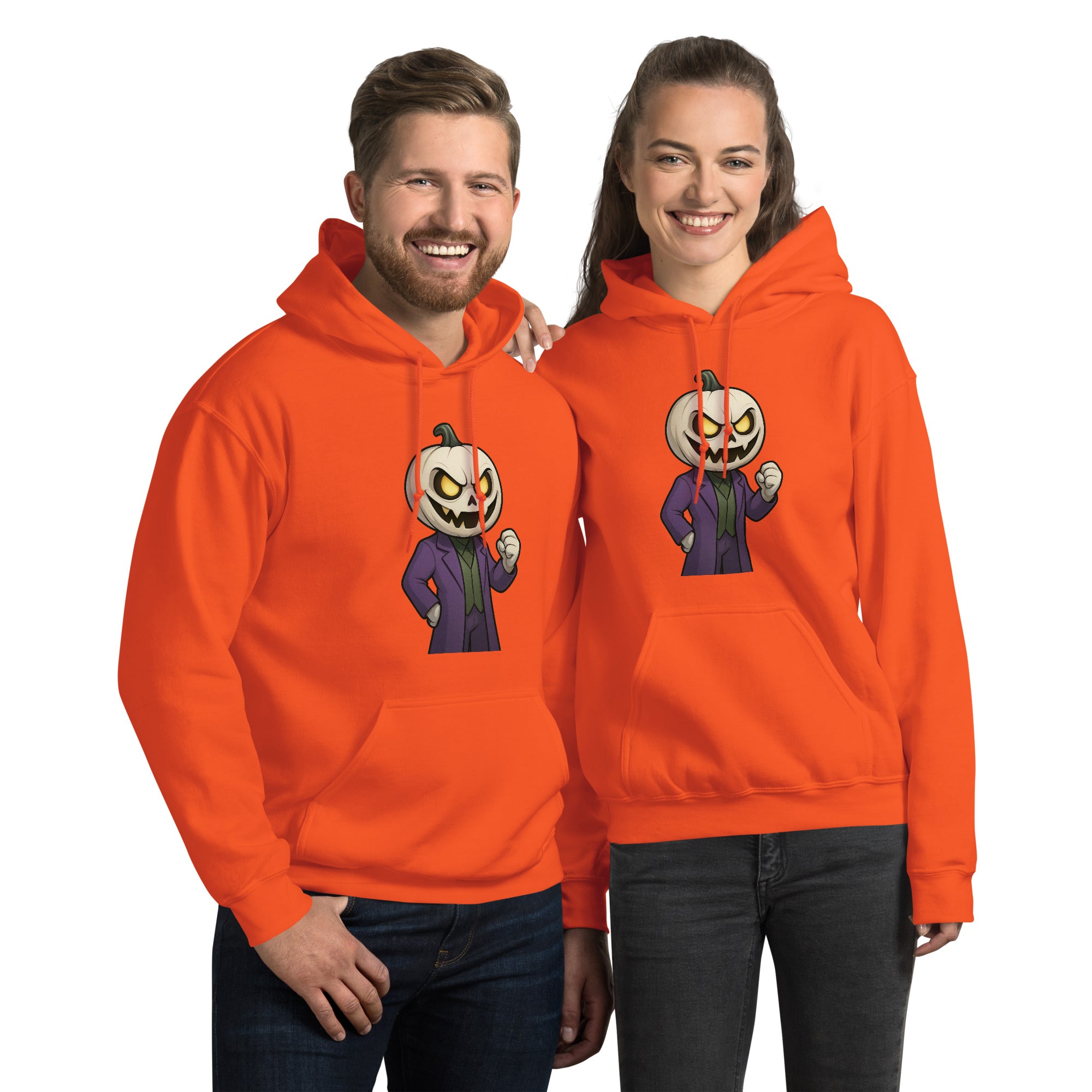 Two people wearing orange hoodies with pumpkin character designs on a white background