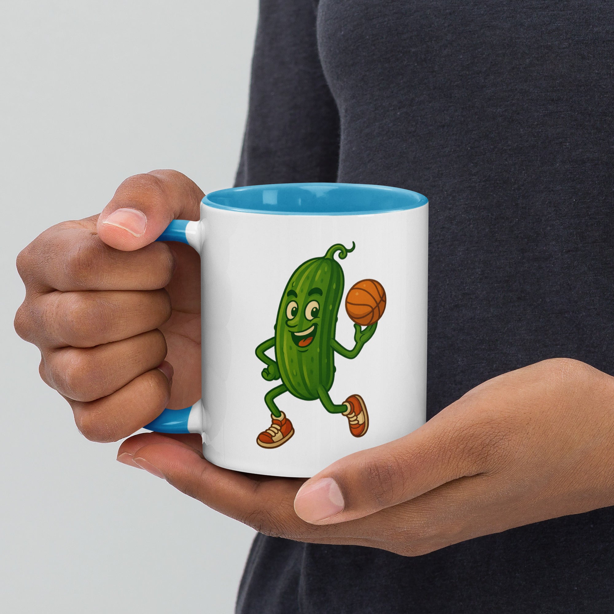 Colorful mug featuring a playful cucumber character holding a basketball, perfect for drinks.