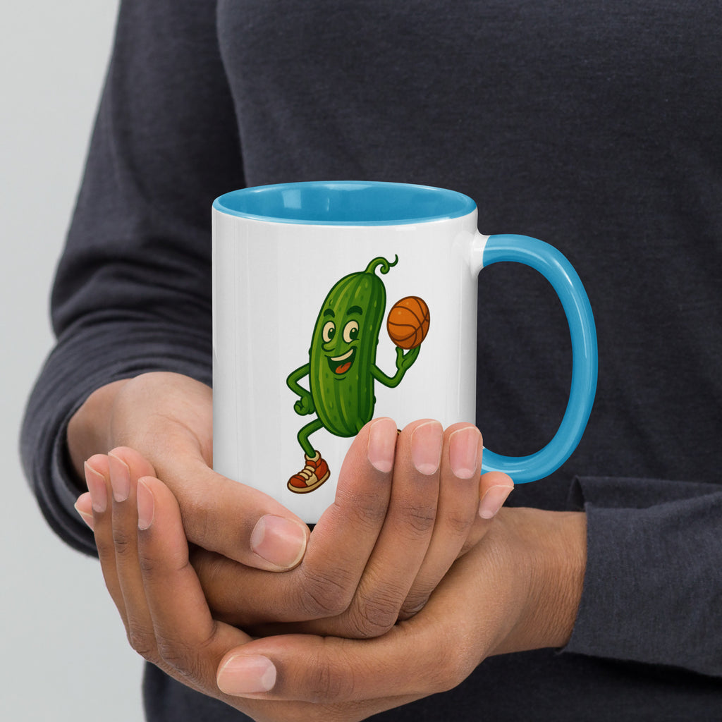 Colorful ceramic mug with a cheerful cartoon pickle character holding a basketball, perfect for quirky coffee lovers.