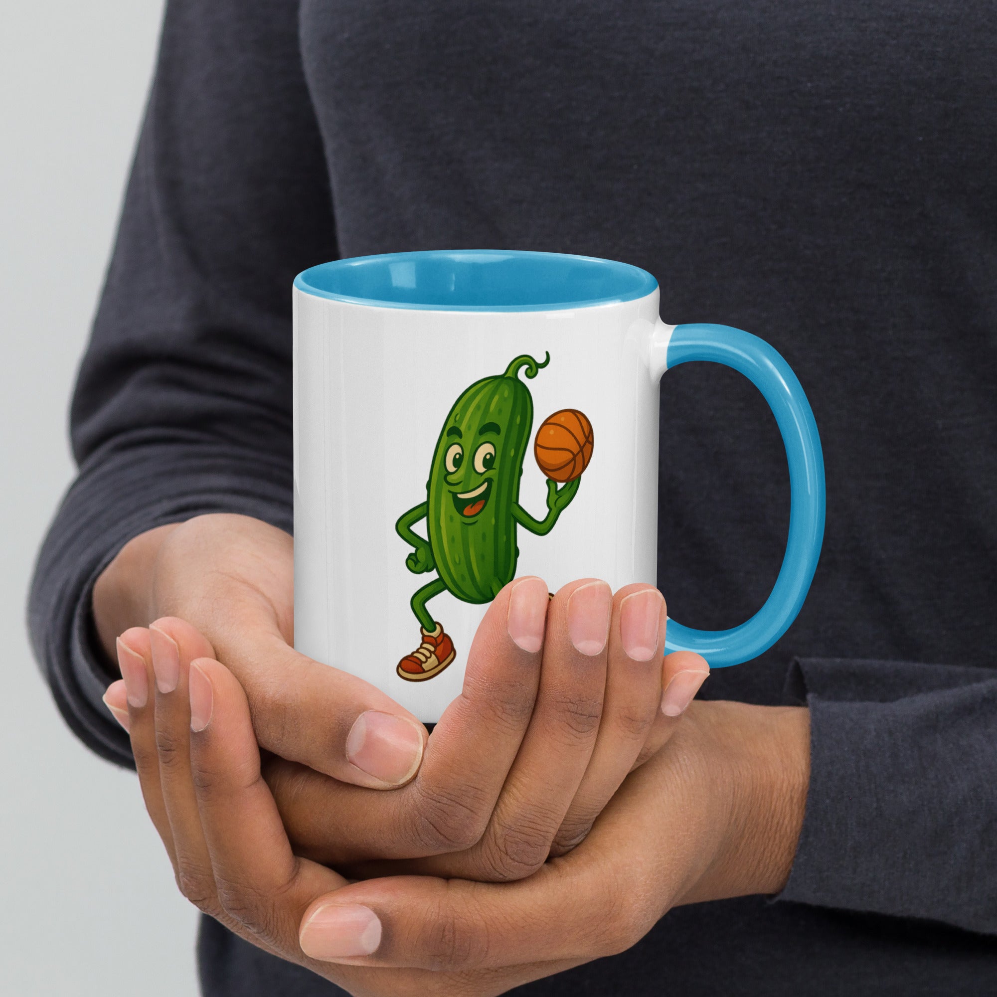 Colorful ceramic mug with a cheerful cartoon pickle character holding a basketball, perfect for quirky coffee lovers.