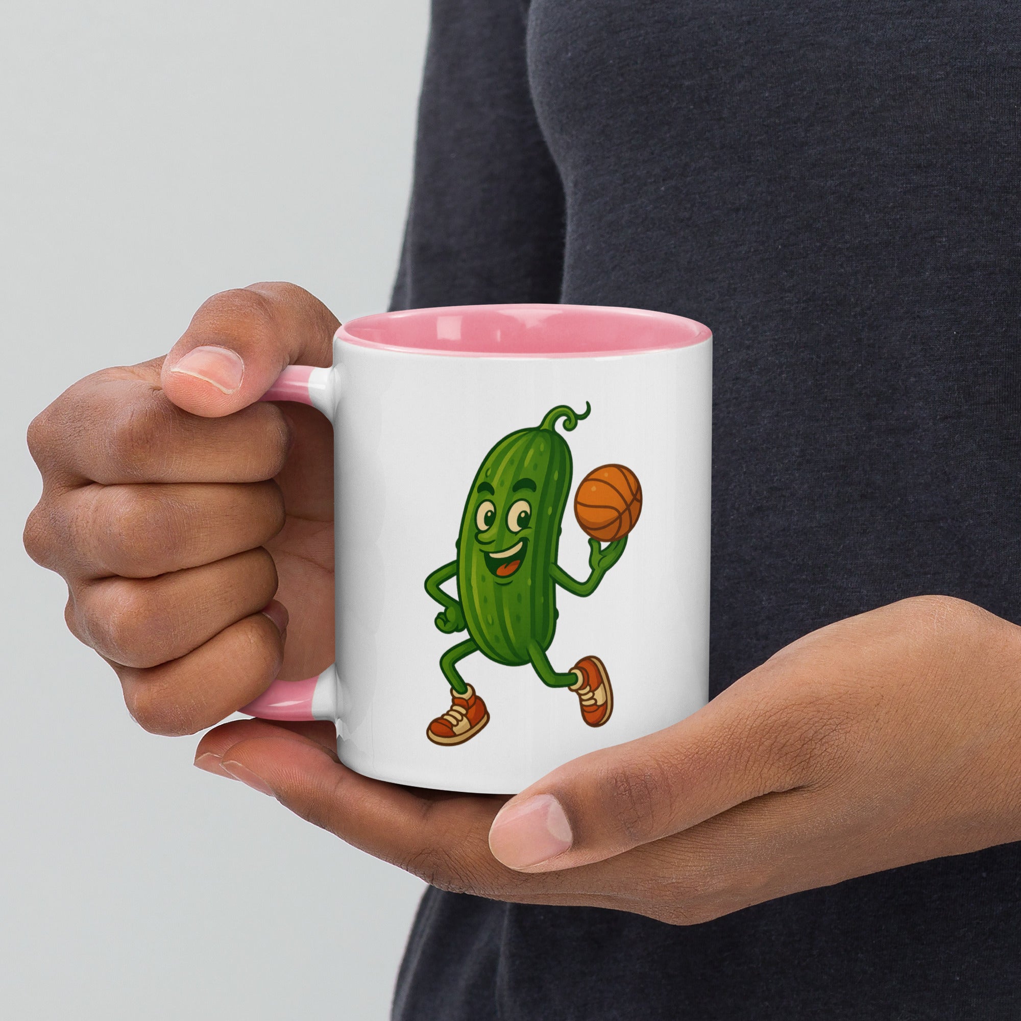 Colorful mug featuring a playful pickle character holding a basketball, perfect for fun coffee moments.