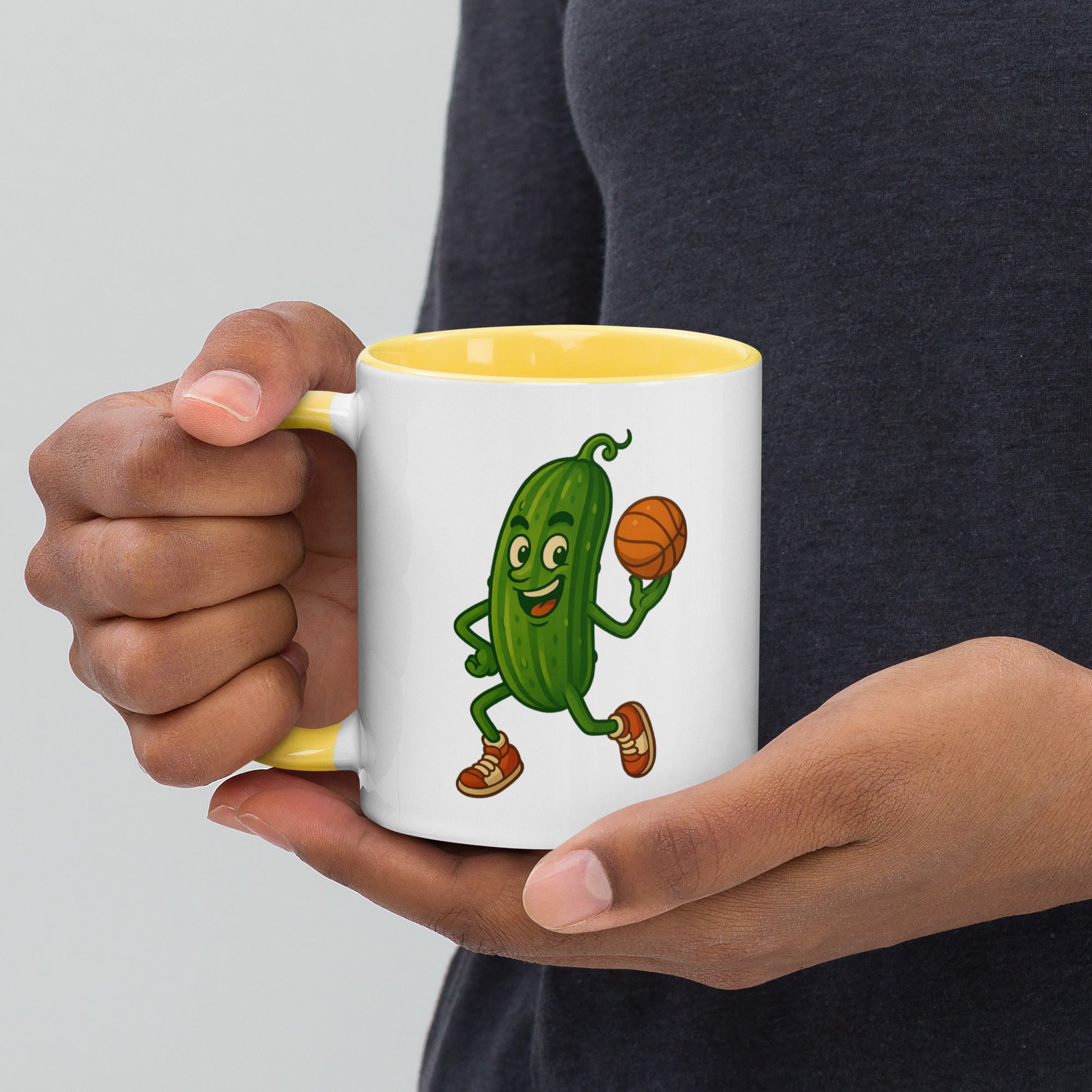 Colorful mug with a cartoon pickle character holding a basketball, ideal for coffee or tea lovers.